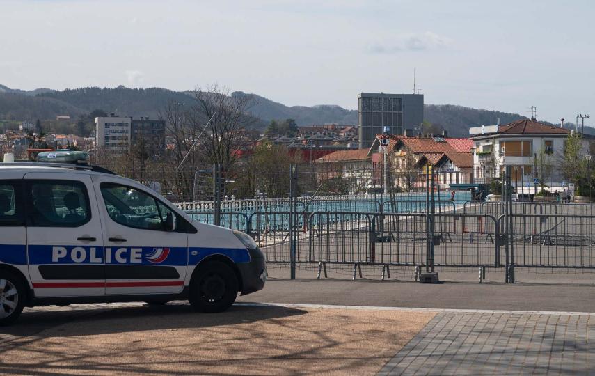 A photograph of a French police car parked on the pedestrian bridge connecting Hendaye, France to nearby Irun, Spain.