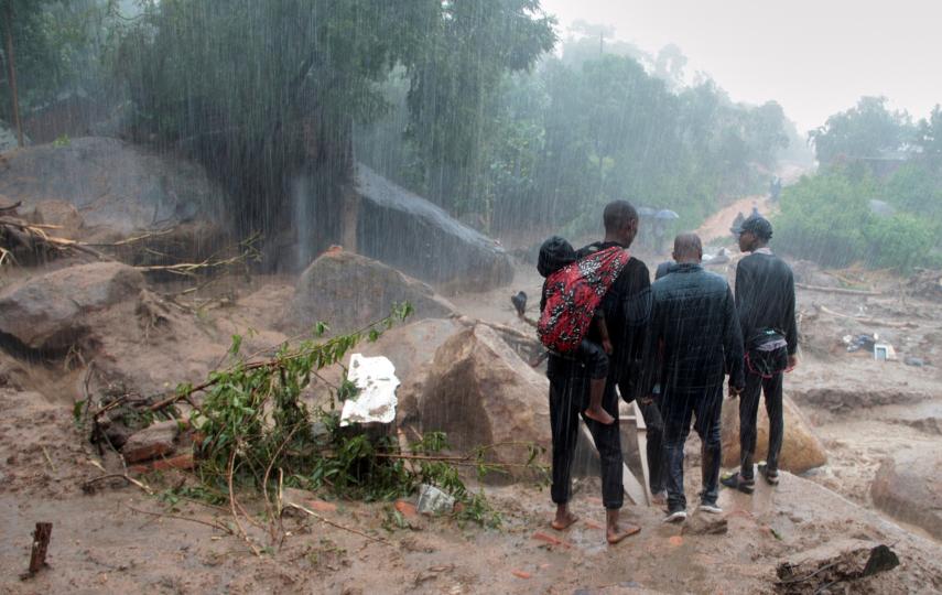Survivors survey the damage caused by Cyclone Freddy in Chilobwe, southern Malawi on 13 March 2023.