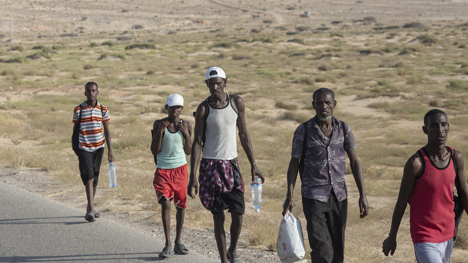 After arriving in Yemen by boat, African migrants take the road inland from the coast to Ataq, in Yemen's southern Shabwa province, 13 November 2020